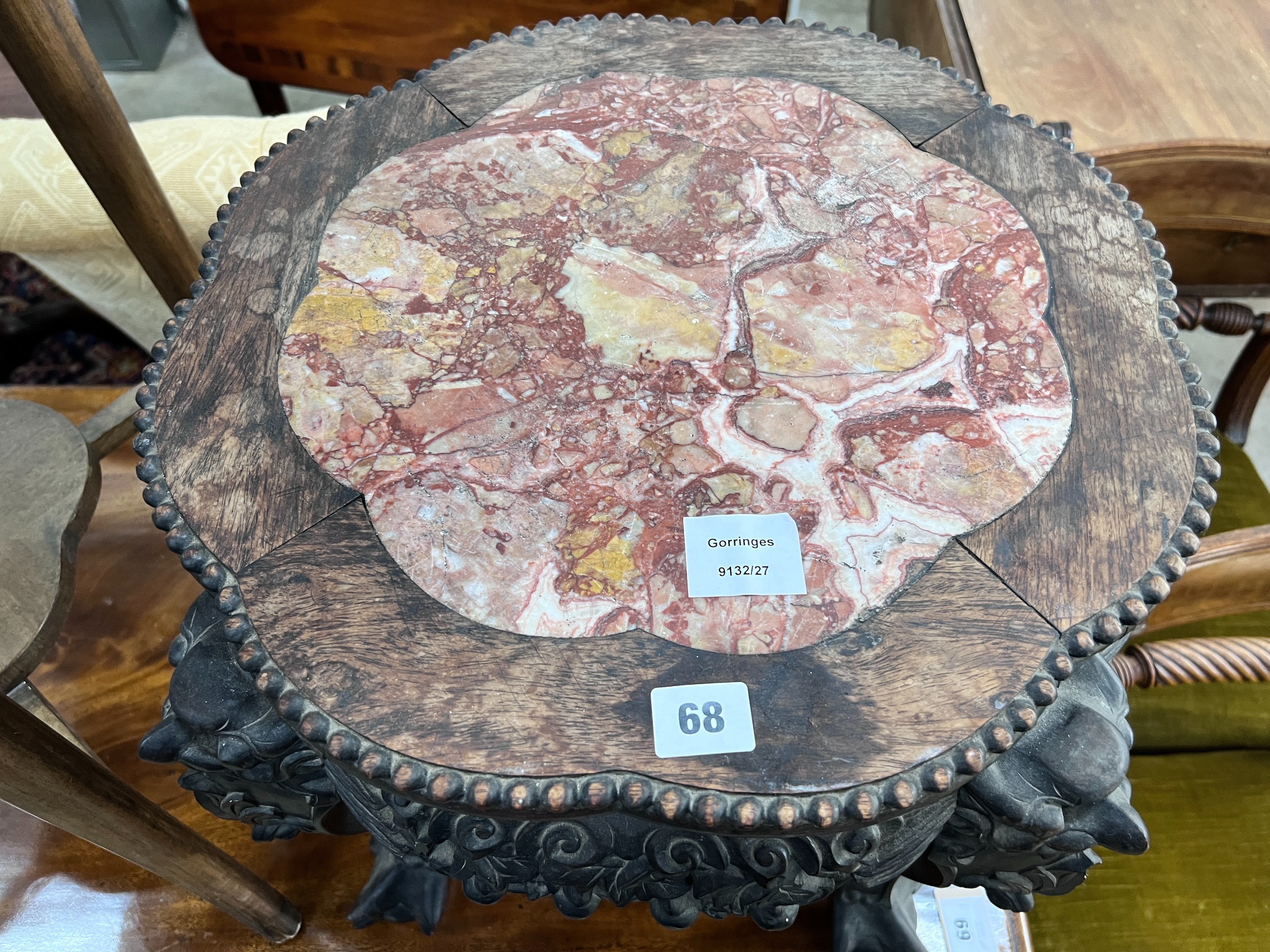 A Chinese carved hardwood rouge marble-topped jardiniere stand, diameter 43cm, height 46cm *Please note the sale commences at 9am.